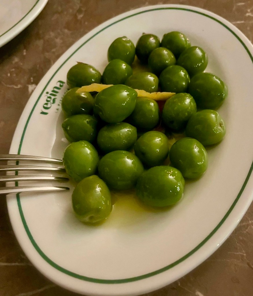 a plate of gigantic juicy green olives 