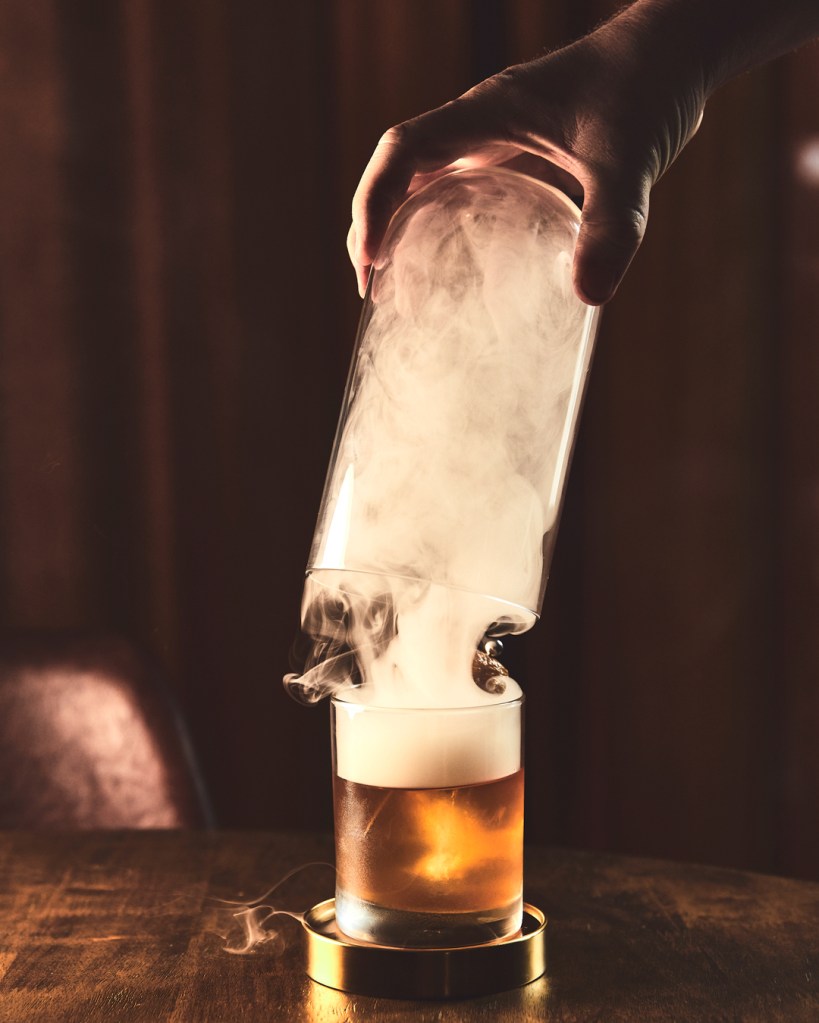 Cocktail, The Smoking Duck. with smoke floating up into the air.